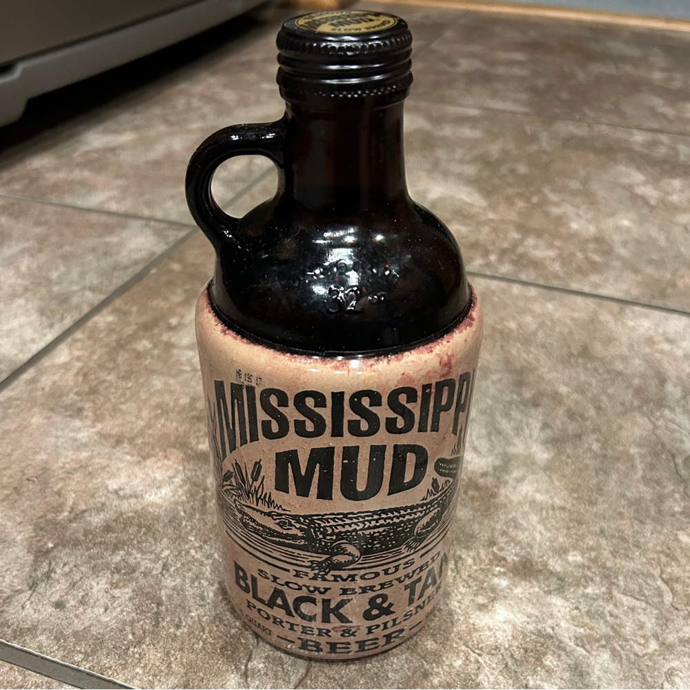 Left handed empty Mississippi Mud bottle